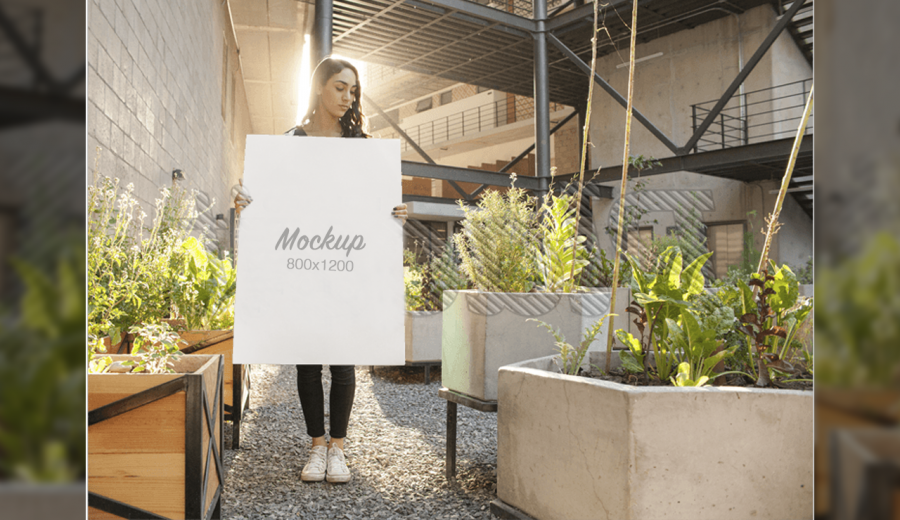 Pretty lady holding a poster mockup