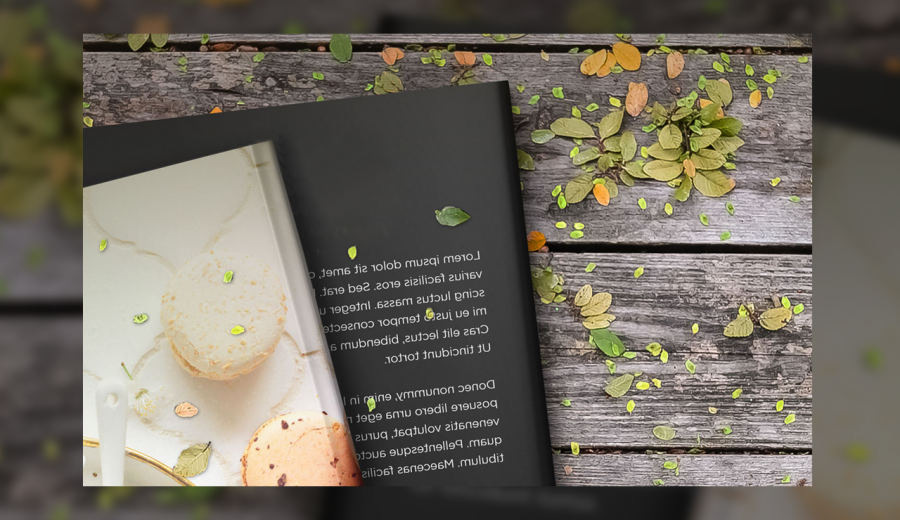 Two books on a wooden table with leaves mockup